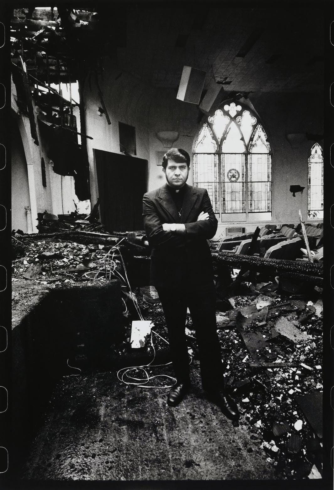The Reverend Troy Perry, Gay Activist, in His Burnt Down Church, Los Angeles, 1973 The Reverend Troy Perry, Gay Activist, in His Burnt Down Church, Los Angeles, 1973
