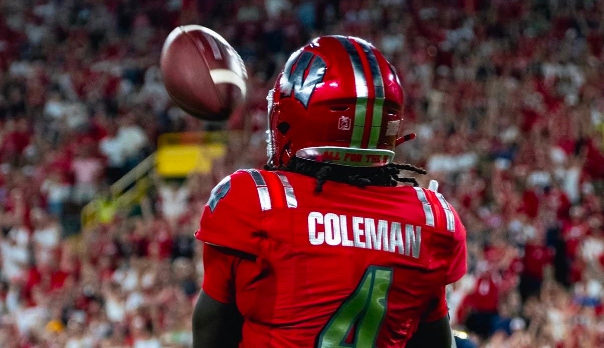 Wisconsin Badgers wide receiver Malachi Coleman catches a pass against Notre Dame at Lambeau Field.