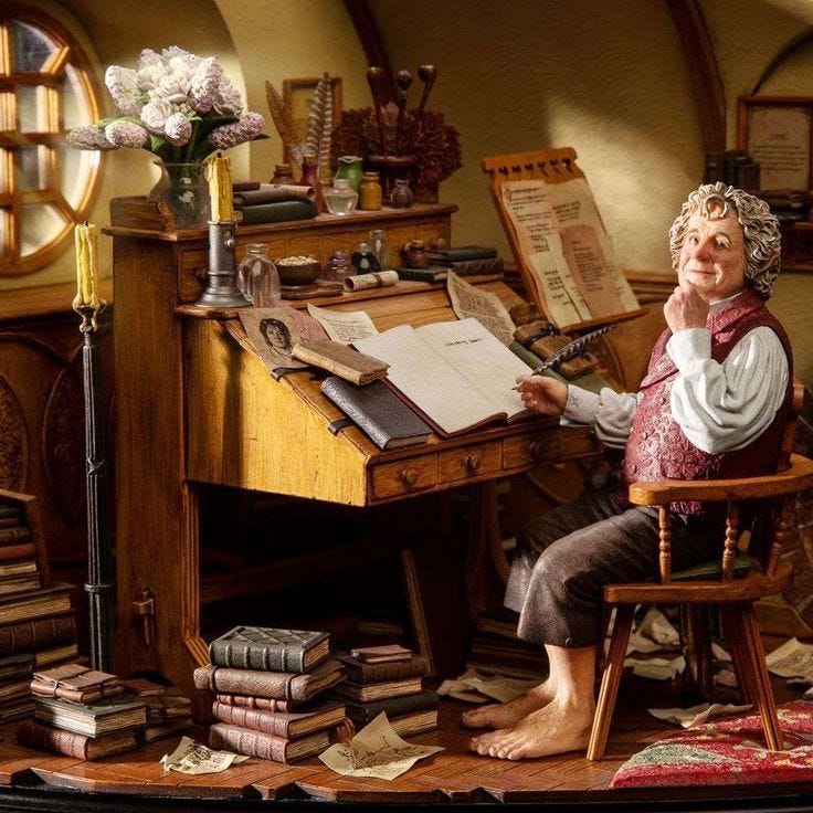 This may contain: an older woman sitting at a desk in front of a pile of books and papers