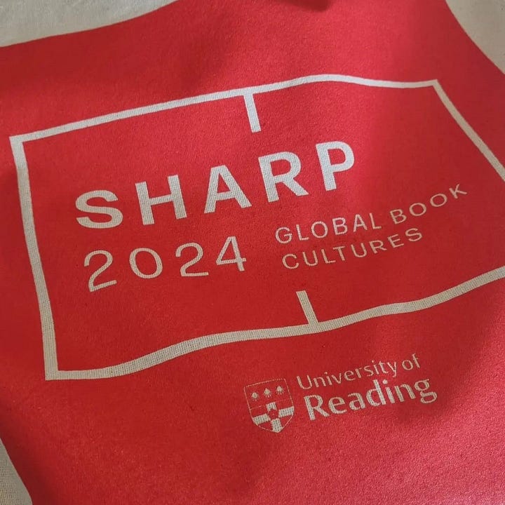 I the first image three white women with dark hair sit in a row. They are speaking on the panel "Finding Book Cultures Outside the Centre", the middle woman is Kim Wilkins, the woman to the right is Alex Dane. The second image is a photo of a canvas tote bag, it is red with the logo for SHARP 2024: Global Book Cultures in cream writing.