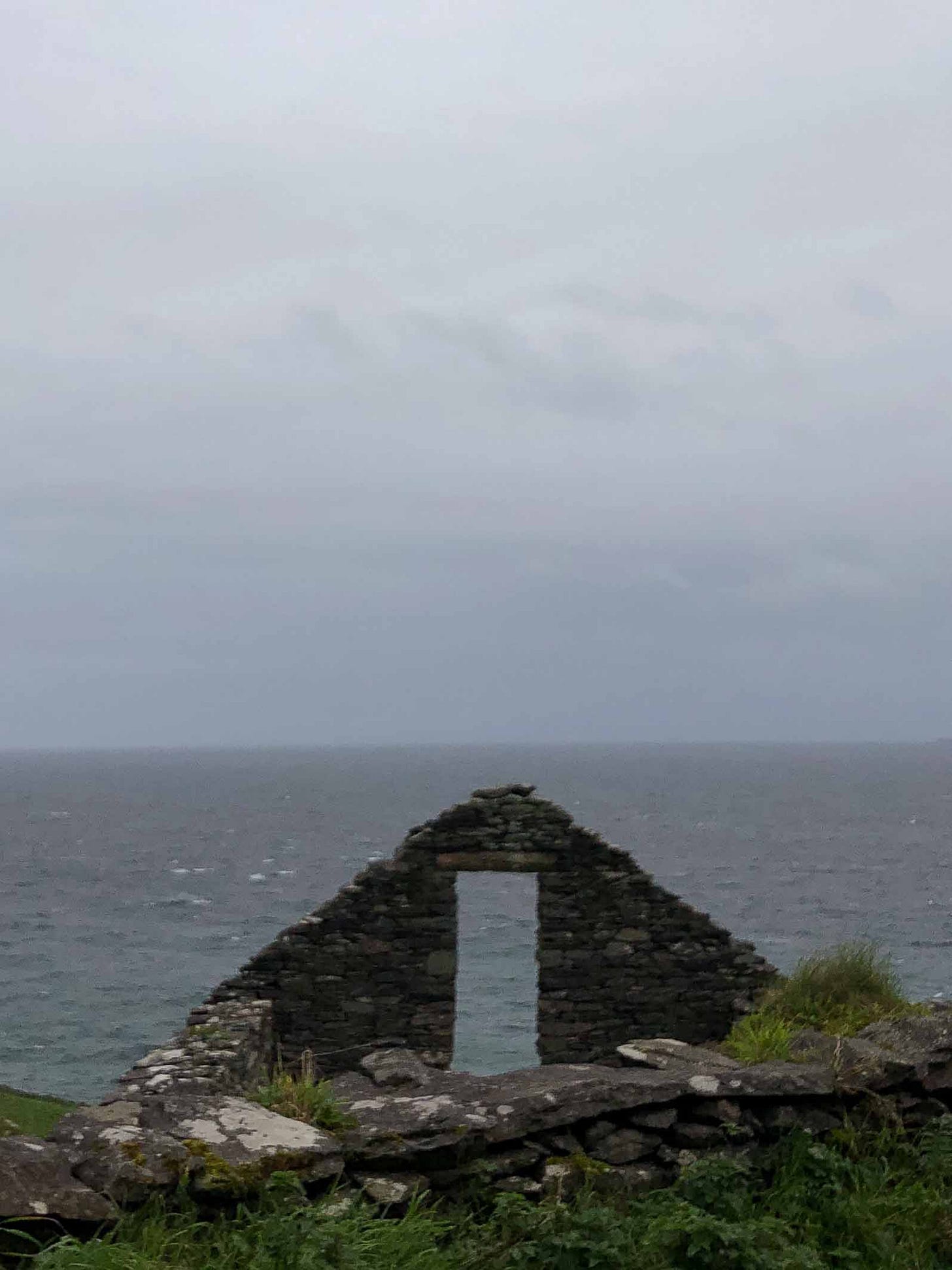 The ruin of a window looks out onto the sea in the west coast of Ireland. Photo credit: Nancy Forde. All rights reserved. nancyforde.com The ruin of a window looks out onto the sea in the west coast of Ireland. Photo credit: Nancy Forde. All rights reserved. nancyforde.com