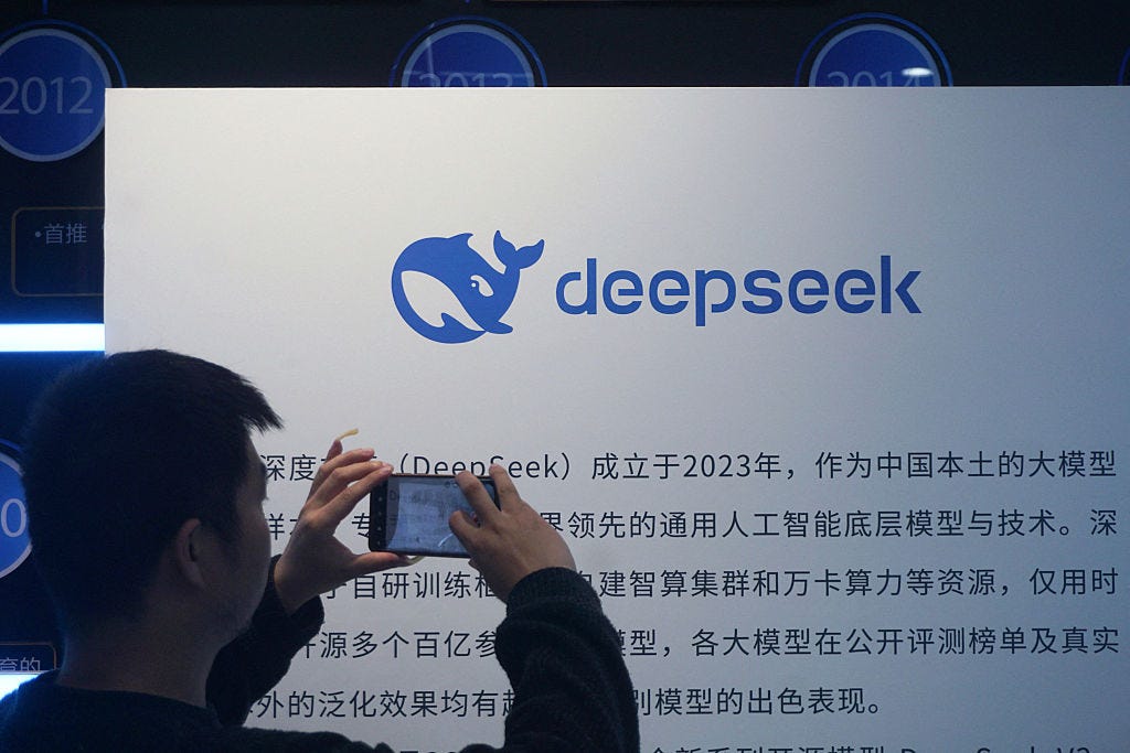 A man takes photos of a DeepSeek display at a shopping mall in Hangzhou A man takes photos of a DeepSeek display at a shopping mall in Hangzhou