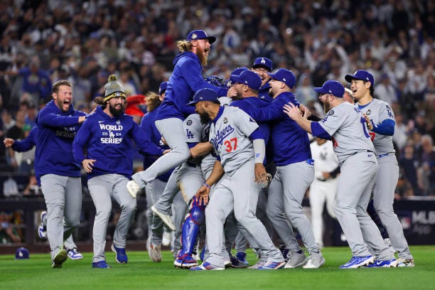 The Los Angeles Dodgers celebrate as the they defeat the New York Yankees 7-6 in game 5 to win the 2024 World Series at Yankee Stadium on October 30,...