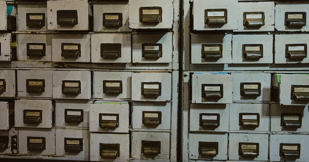 Rows of old filing cabinets with labels Rows of old filing cabinets with labels