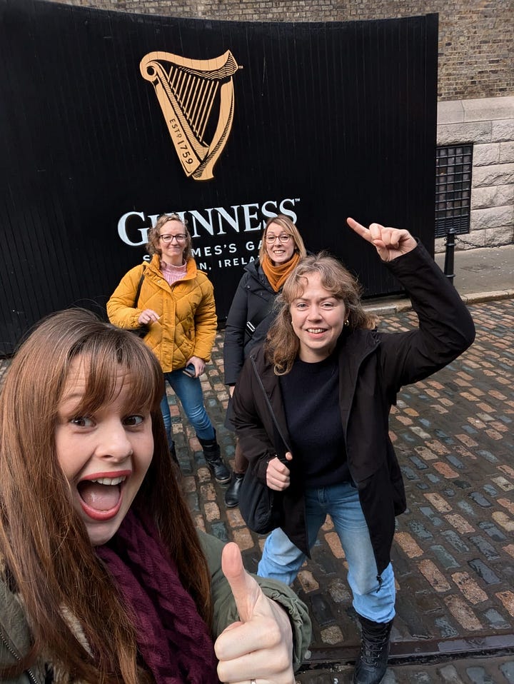Two side-by-side photos of four women smiling outside Dublin pubs. In the first, they stand in front of the green and yellow exterior of The Hairy Lemon. In the second, they pose on cobbled streets in front of a Guinness sign, laughing and gesturing enthusiastically at the camera.