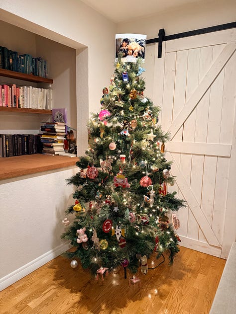 A photo of Meg's Christmas tree, featuring a mailbox ornament, an octopoidal ornament, and a photo of Andrea & Meg at the top.