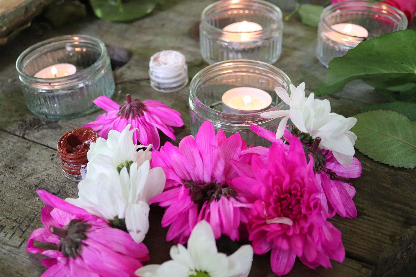 Candles and flowers on a wooden table