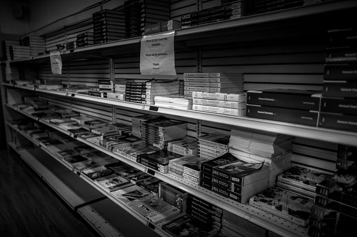 images from inside the bookstore including college physics textbooks and textbooks for sale, branded water bottles and trinkets, and HBCU themed T-shirts