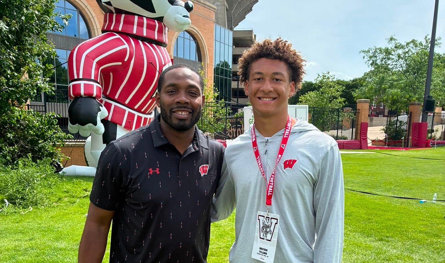 Wisconsin assistant coach Kenny Guiton and 2028 quarterback recruit Brayden Tillman during an unofficial visit for Bucky's BBQ.