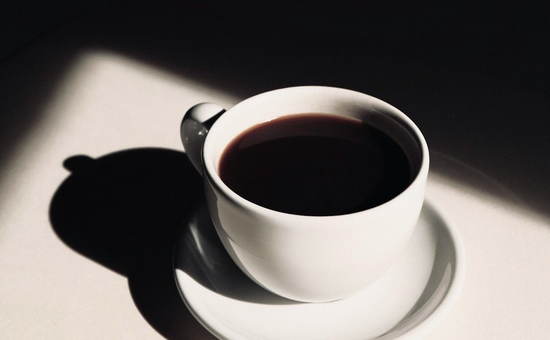 white ceramic teacup on saucer