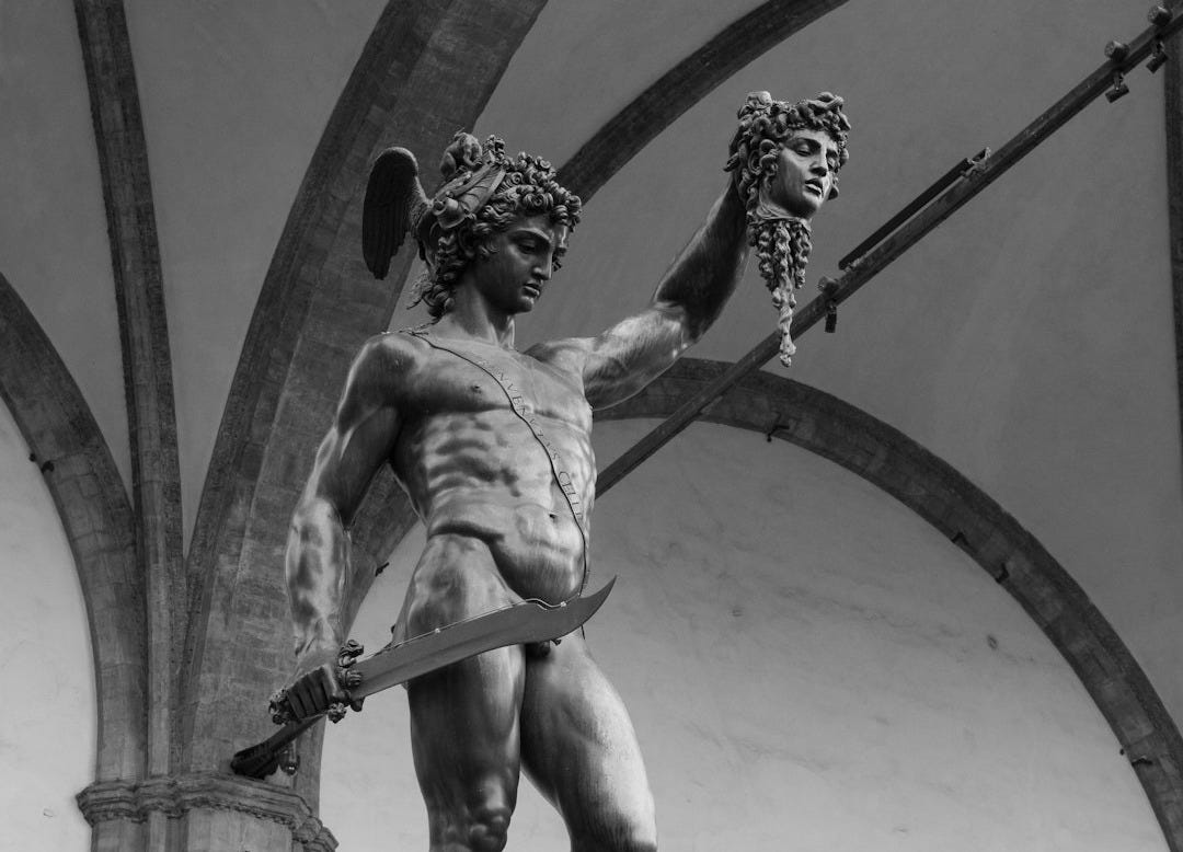 a black and white photo of a statue