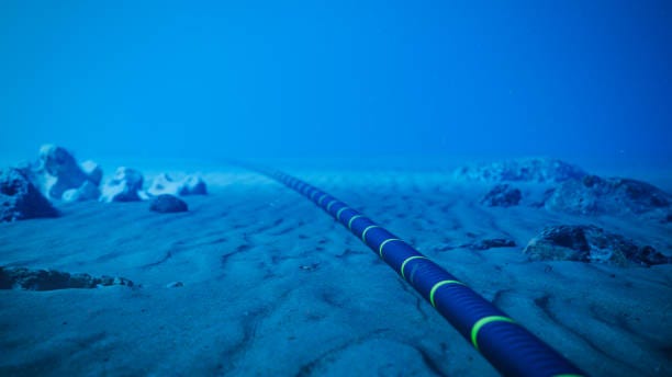 Underwater Fiber Optic Cable On Ocean Floor Underwater fiber-optic cable on ocean floor. undersea cables stock pictures, royalty-free photos & images