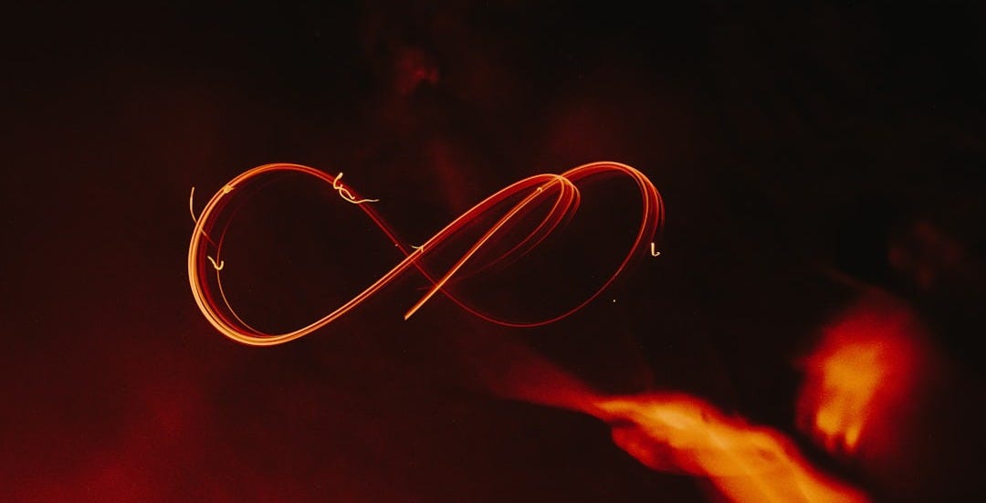 a close up of a red object in the dark