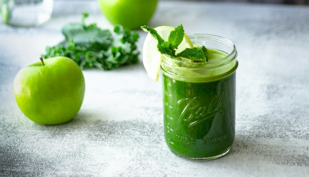 green apple fruit in clear glass cup green apple fruit in clear glass cup