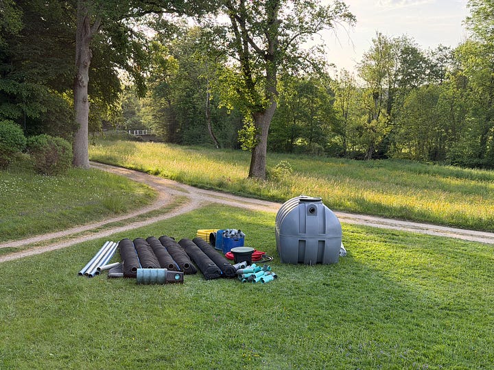 Left: a Penet delivery truck arriving at a French château with the new septic tank. Right: the new septic tank and components laid out on the lawn before installation.