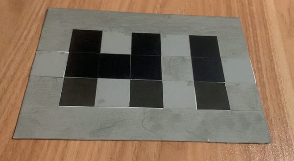 two animations of black and gray pixels changing to show different scenes. on the left, the letters HI turn into a smiley face. on the right, the animations ripple across a square and from the center of a circle