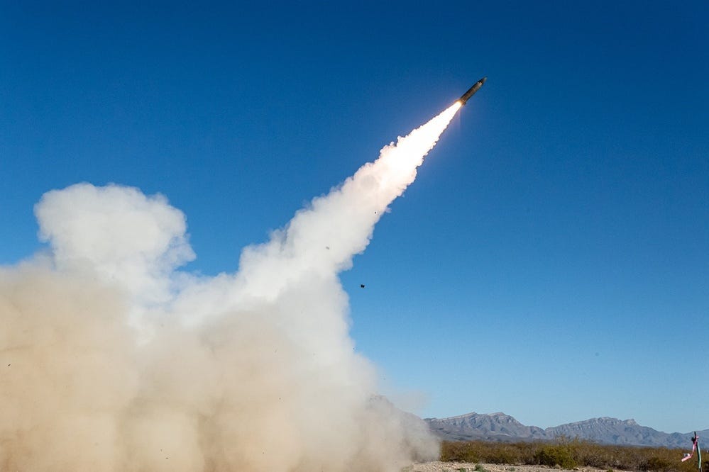 A Precision Strike Missile climbs above the desert, leaving a bright flame and smoke trail. A Precision Strike Missile climbs above the desert, leaving a bright flame and smoke trail.