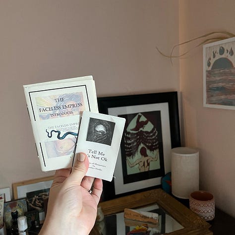Me holding up some of my favorite zines purchased at Wasted Ink Zine Distro or Phoenix Zine Fest