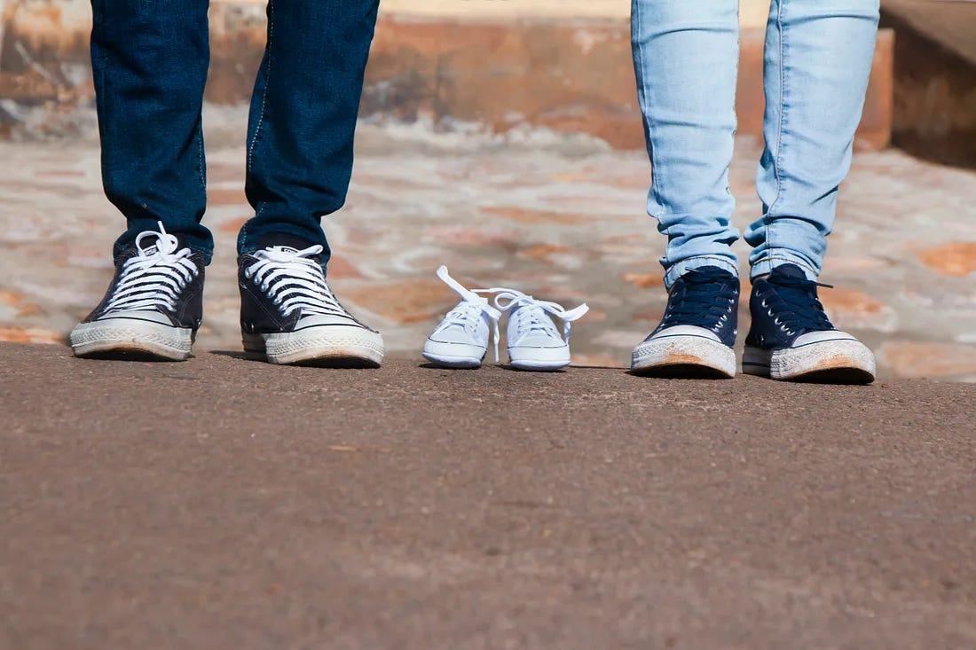 three sets of feet - including a child's