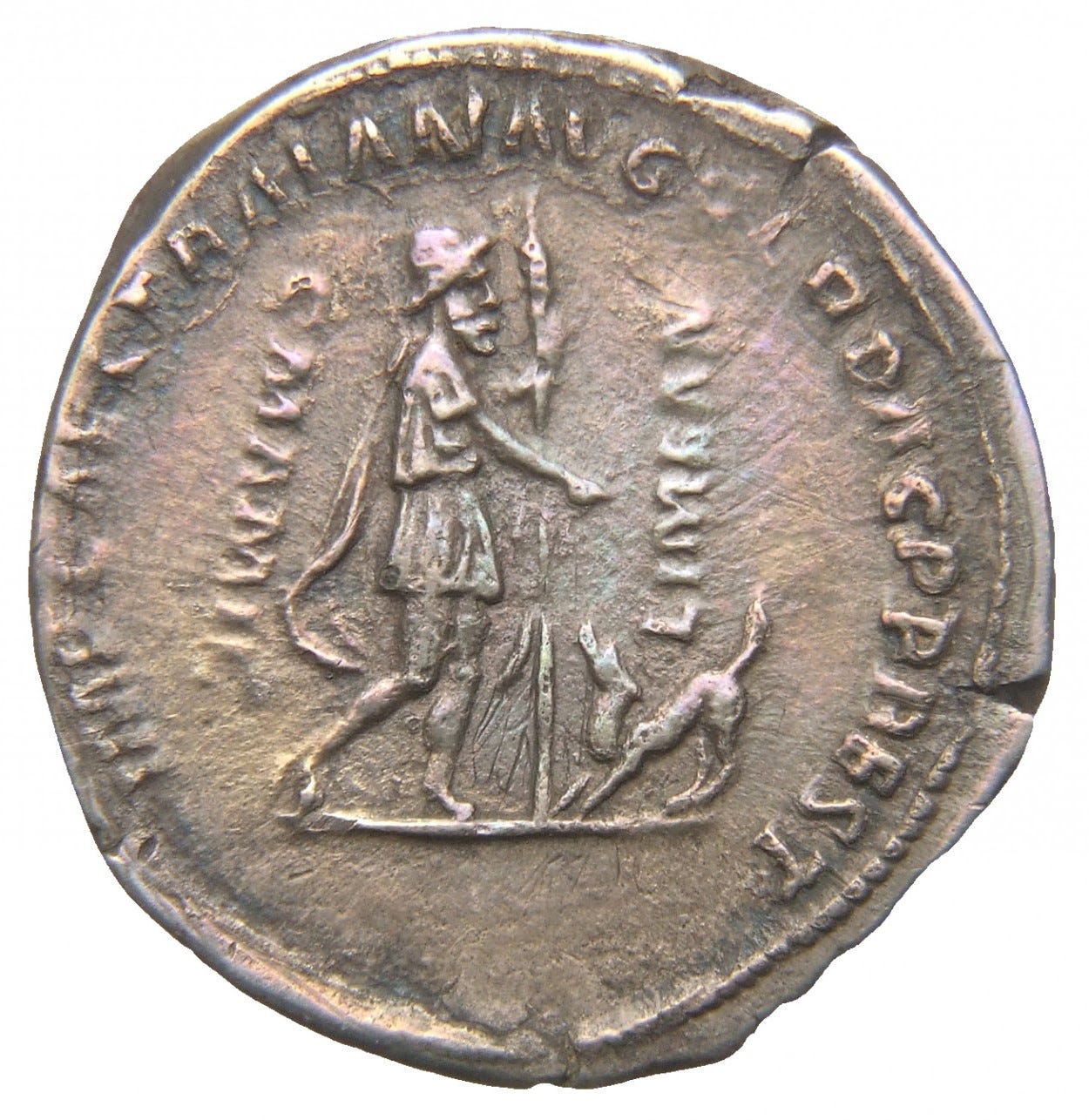 Silver coin: Odysseus, at left, wears a traveller's hat and cloak and carries a staff; Argus greets him with his head raised and tail wagging. An inscription naming the emperor Trajan is faintly visible.