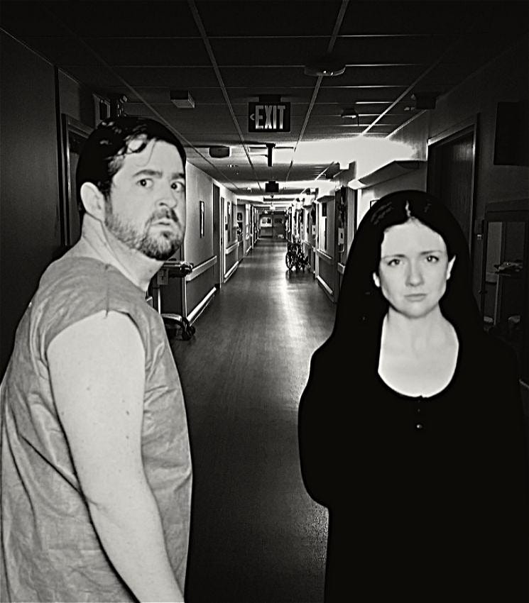 Black and white photo of two people in a hospital corridor. A man in a hospital gown has his back to the camera, but is turned with a confused expression to the camera. A woman dressed in black stands facing the camera. She has a strong, controlling, and knowing look on her face.