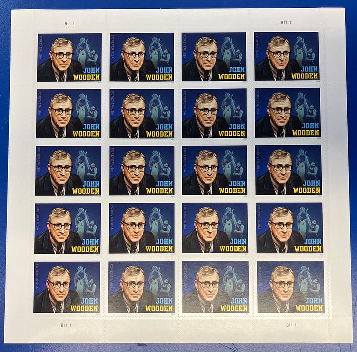 Image of John Wooden stamps and the Pyramid of Success, at the Morgan Center Hall of Fame at UCLA