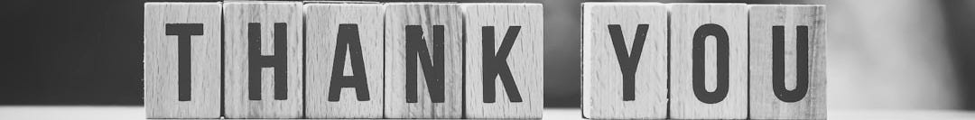 brown and white wooden arrow sign