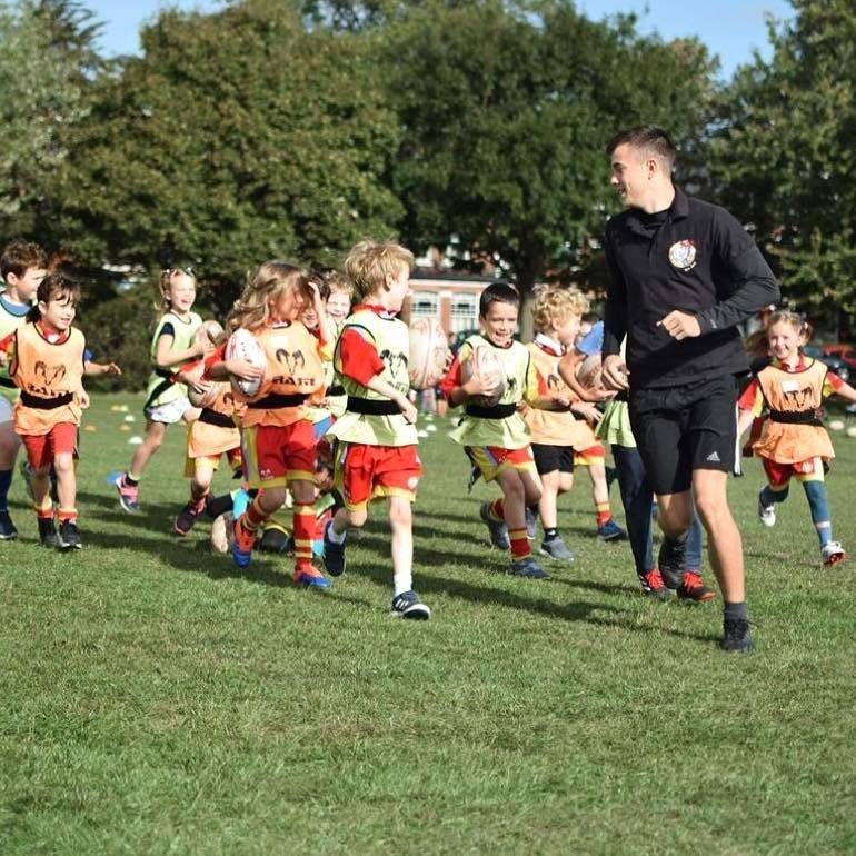 May be an image of American football and football