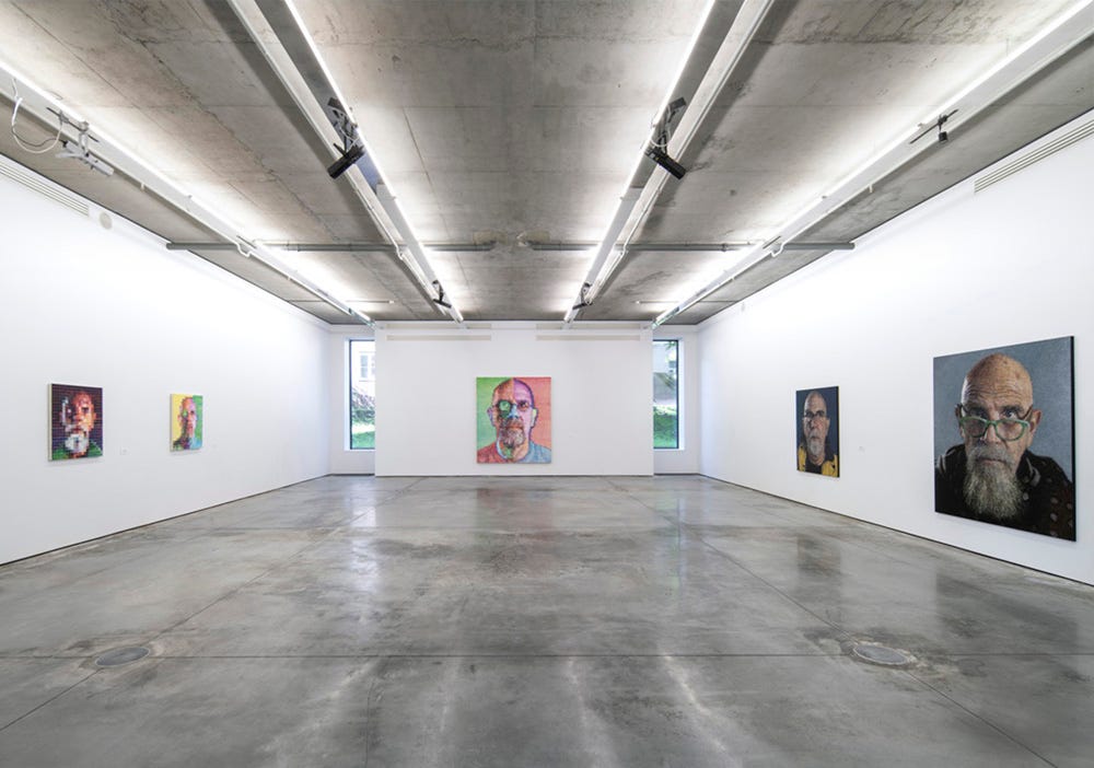 Chuck Close portraits at the exhibition Chuck Close. Infinite, Gary Tatintsian Gallery, Moscow, 2007.