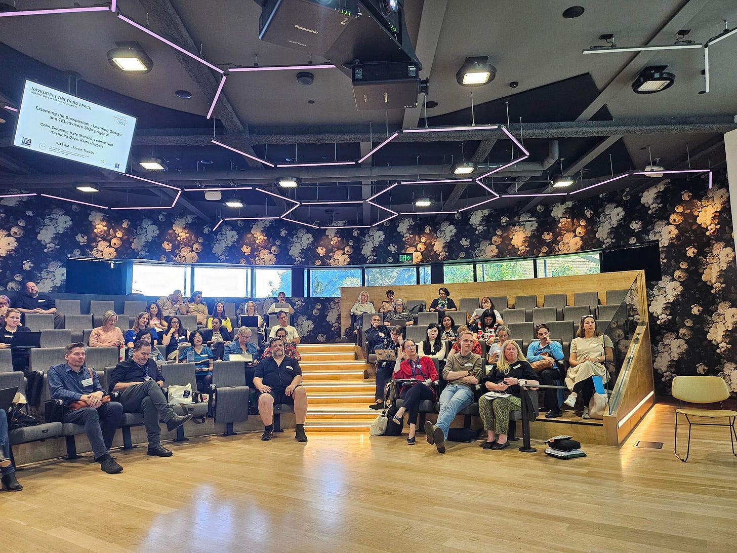 people in a modern lecture theatre people in a modern lecture theatre