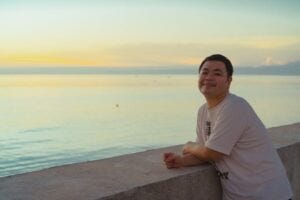 Man at the beach at sunset
