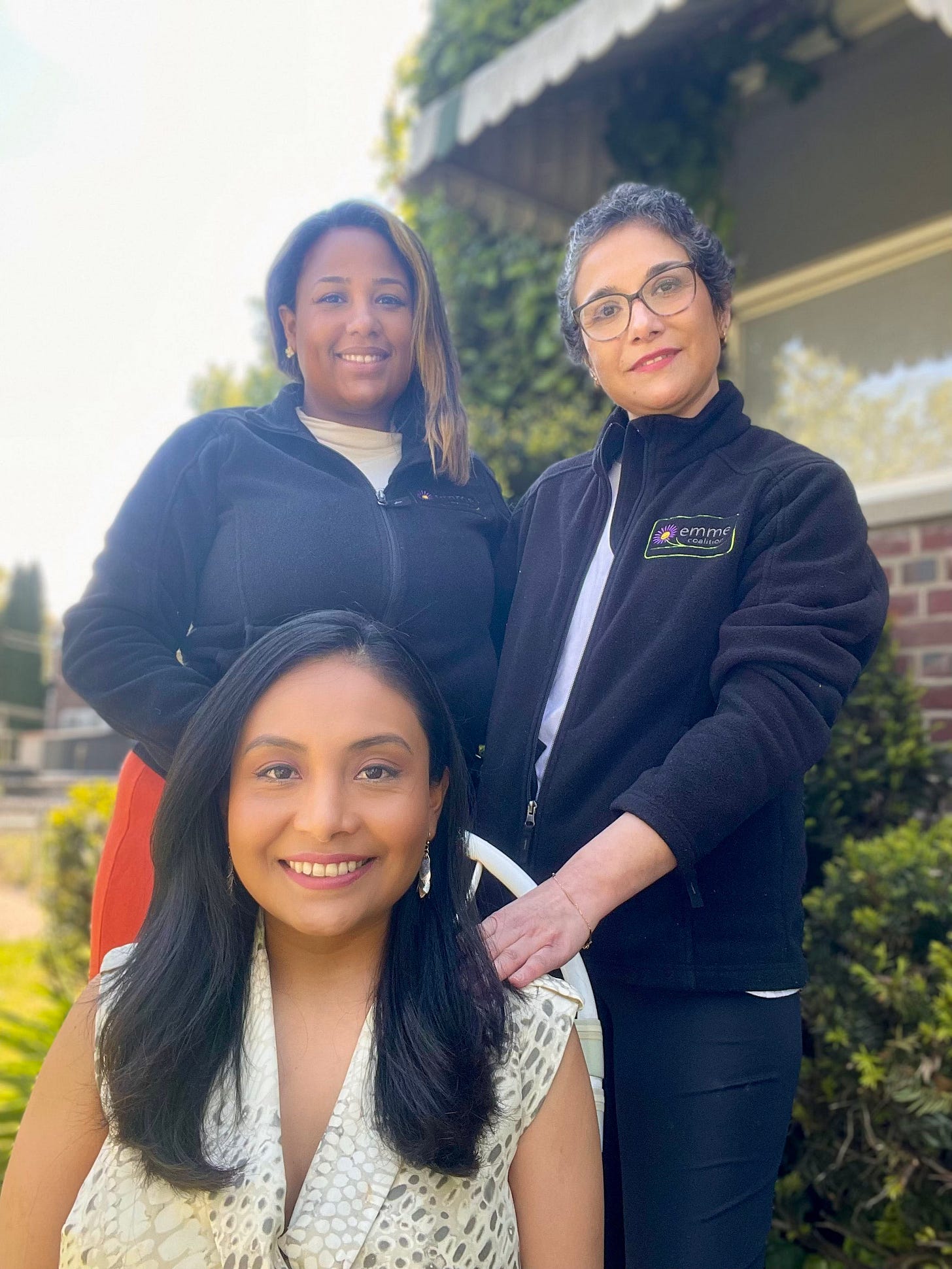 A group photo of Milagros Aquino (center, seated) with community health worker Massiel Olivo (left) and Jacqueline Carrizo (right). A group photo of Milagros Aquino (center, seated) with community health worker Massiel Olivo (left) and Jacqueline Carrizo (right).