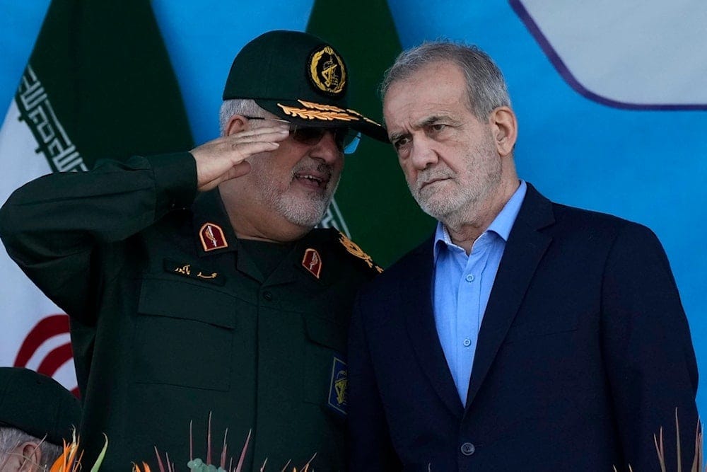 Iranian President Masoud Pezeshkian, right, listens to the commander of the Islamic Revolution Guard Corps' ground force, General Mohammad Pakpour just outside Tehran, Iran, September 21, 2024 (AP) Iranian President Masoud Pezeshkian, right, listens to the commander of the Islamic Revolution Guard Corps' ground force, General Mohammad Pakpour just outside Tehran, Iran, September 21, 2024 (AP)
