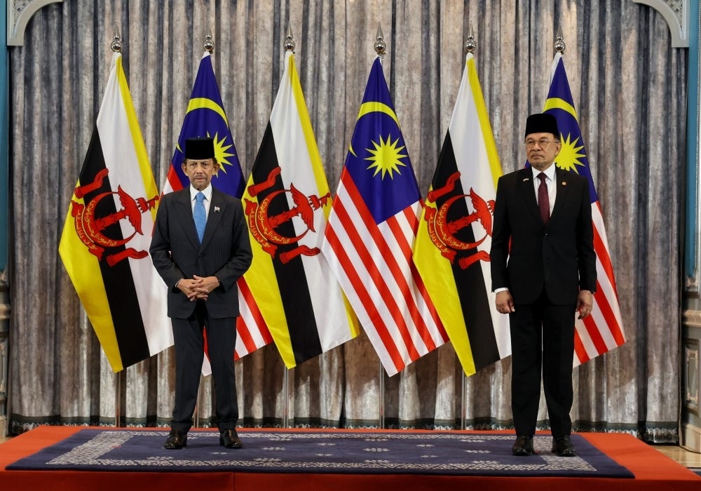 The Sultan of Brunei, Sultan Hassanal Bolkiah (left), with Prime Minister Datuk Seri Anwar Ibrahim at the 26th Malaysia-Brunei Annual Leaders' Consultation (ALC) at the Seri Perdana Complex August 27, 2025. — Bernama pic