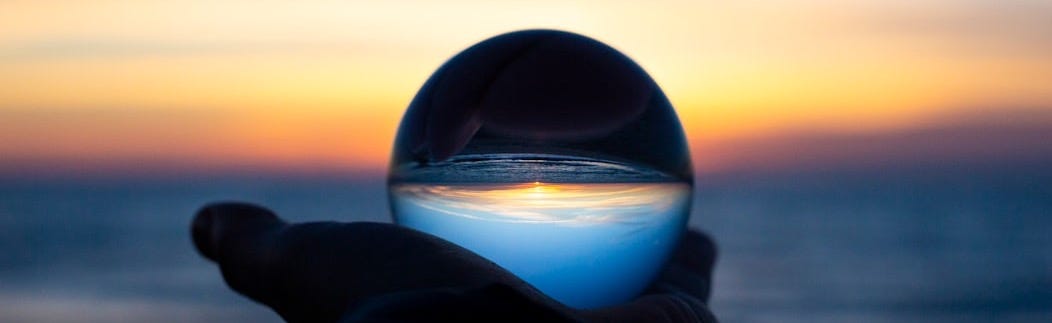 person holding clear glass glass