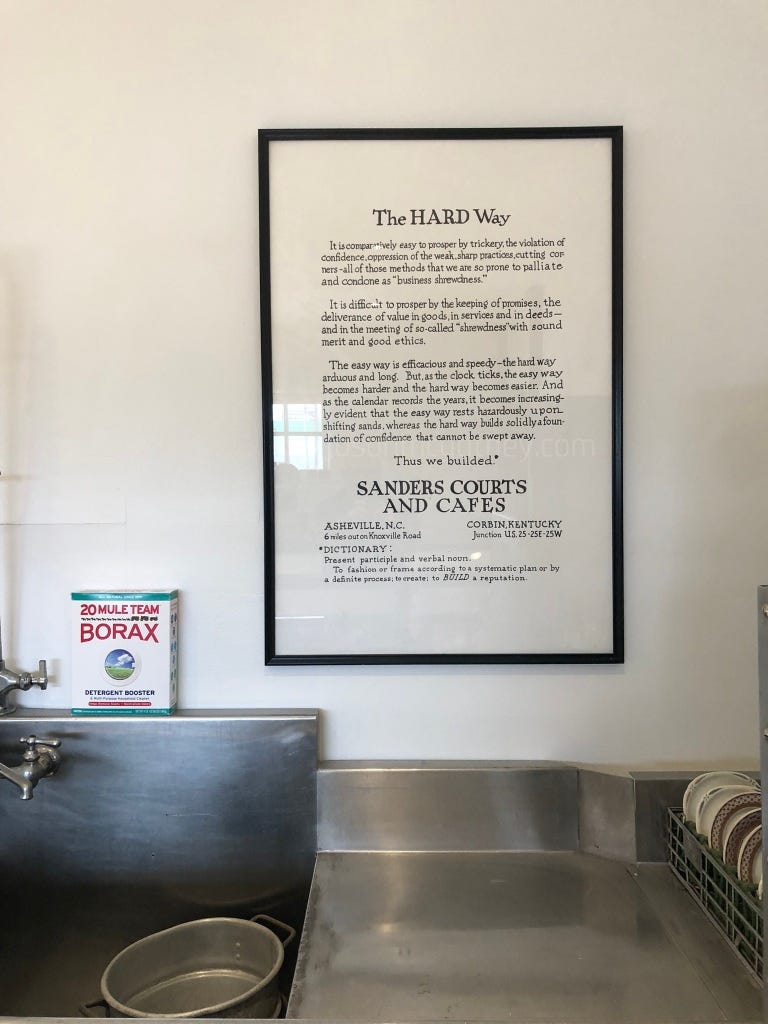 Sanders Court and Cafe slogan sign