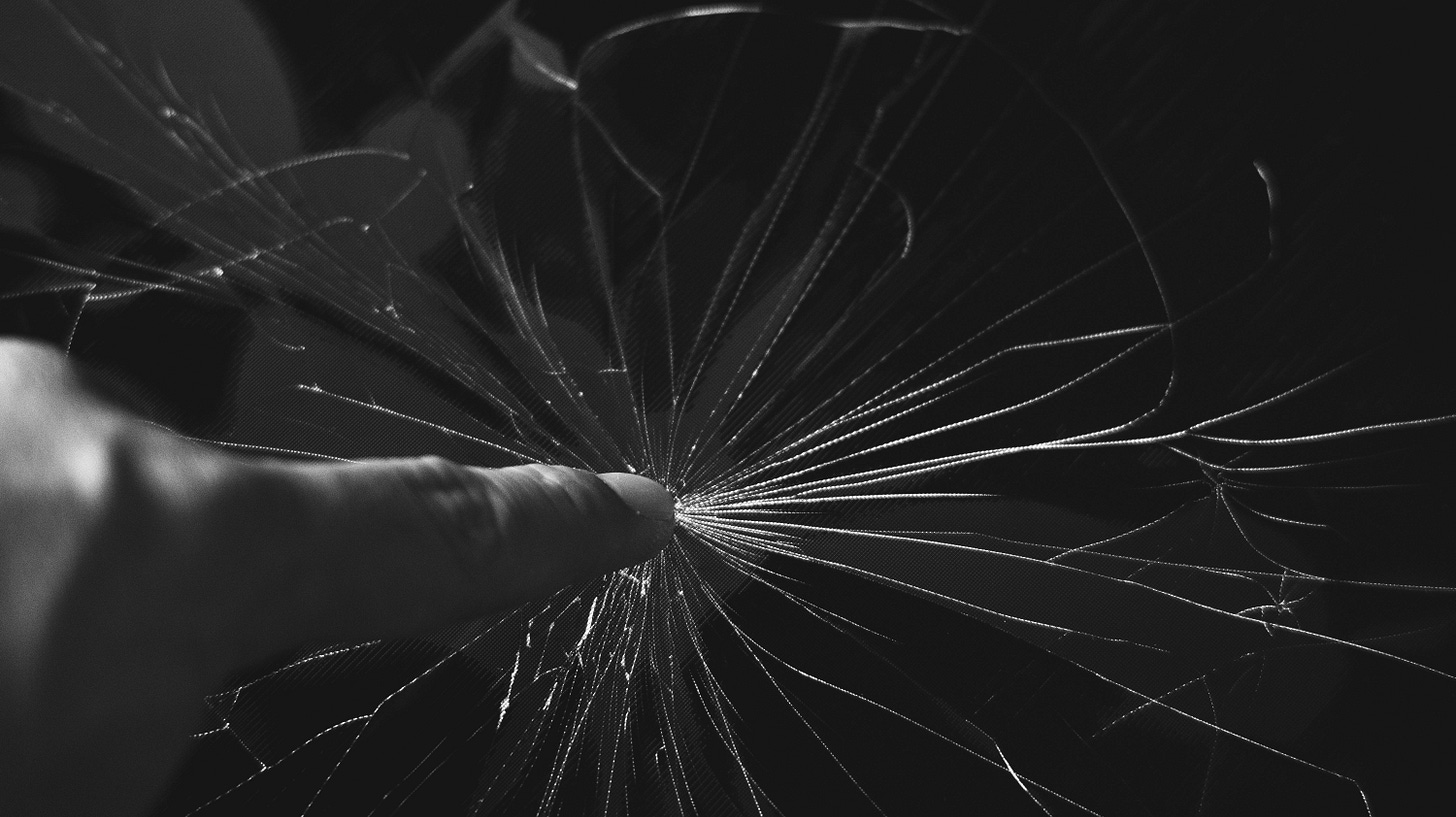 Photo by Nothing Ahead: https://www.pexels.com/photo/black-and-white-photo-of-finger-touching-cracked-glass-7666813/