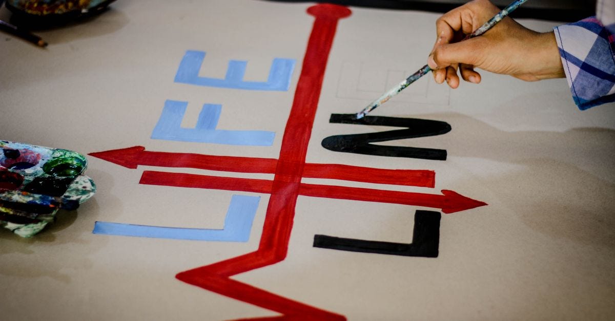 Photo: Ahmed akacha / Pexels Close-up of colorful hand-painted lifeline arrow artwork symbolizing creativity and design.