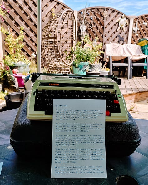 Typewritten pages in front of a typewriter on a table in the garden - see text below for what the pages say