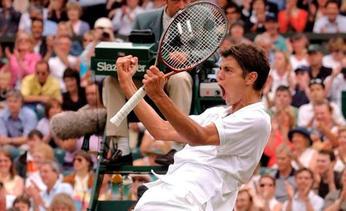 WIMBLEDON TENNIS CHAMPIONSHIPS. MARIO ANCIC CELEBRATES HIS VICTORY OVER ROGER FEDERER 24/06/2002 EXPRESS NEWSPAPERS CODE:369137 REF - ROBINSON (Express Newspapers via AP Images)