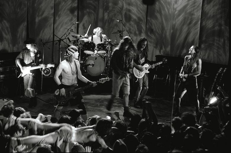 At the end of this memorable show at RKCNDY on Aug. 3, 1991, Pearl Jam was joined by Soundgarden’s Chris Cornell, center, and drummer Matt Cameron, for a short Temple of the Dog set. Earlier in the show, the Pearl Jam song “Alive” was filmed for a video. (Lance Mercer / 1991) At the end of this memorable show at RKCNDY on Aug. 3, 1991, Pearl Jam was joined by Soundgarden’s Chris Cornell, center, and drummer Matt Cameron, for a short Temple of the Dog set. Earlier in the show, the Pearl Jam song “Alive” was filmed for a video. (Lance Mercer / 1991)