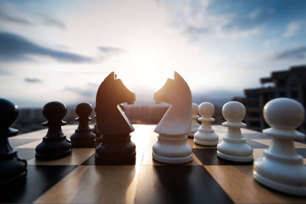 Two chess knights battle on city background Two chess knights battle on city background. oppose stock pictures, royalty-free photos & images Two chess knights battle on city background Two chess knights battle on city background. oppose stock pictures, royalty-free photos & images