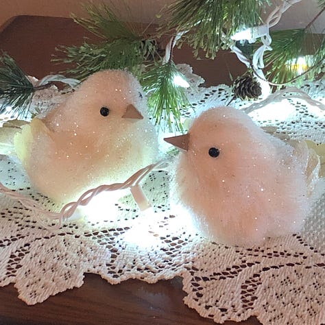 A collection of ornaments and quilted decorations in red, green and sparkling white.