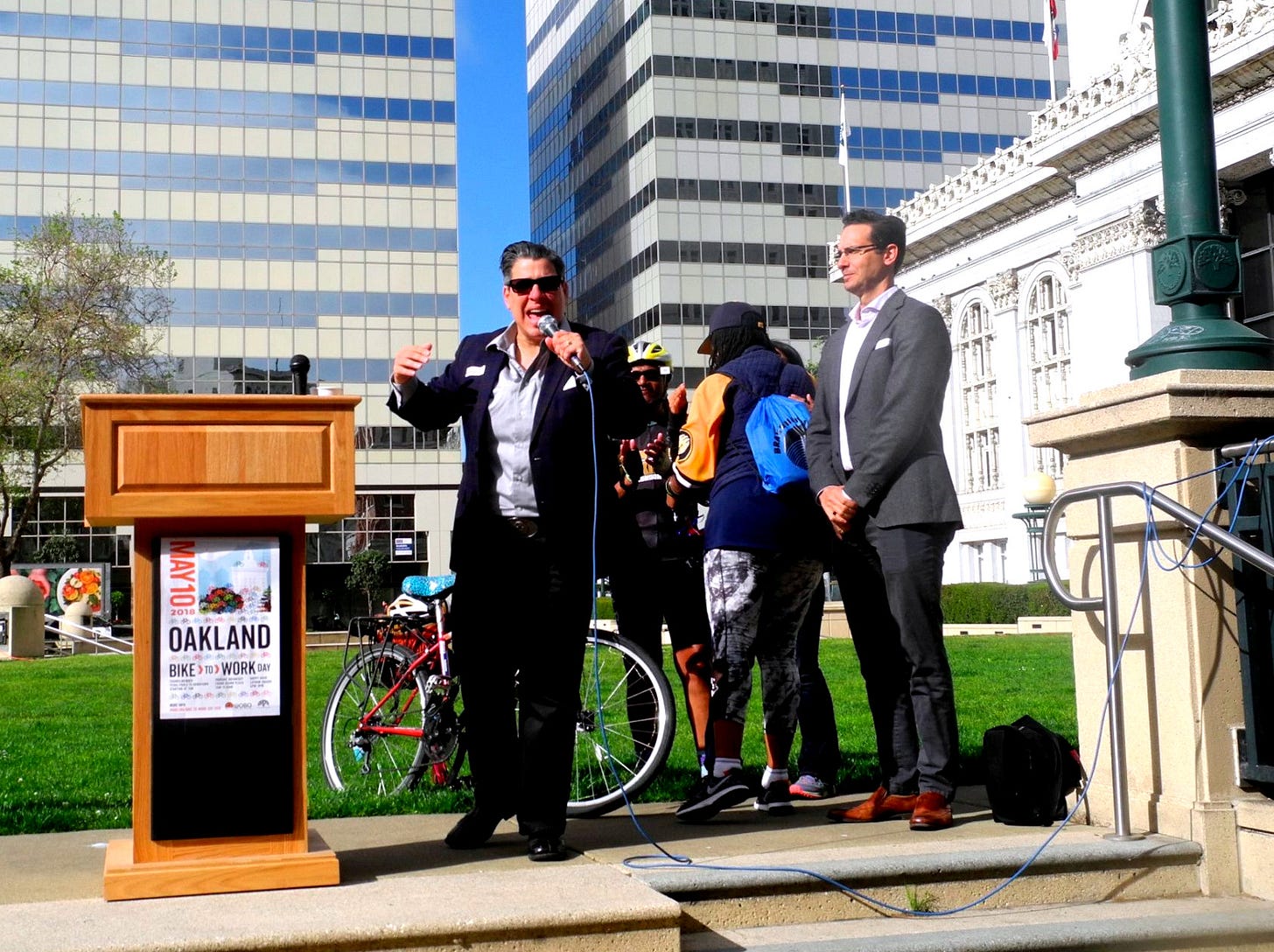 Rebecca Kaplan at a bike to work day event, May 10, 2018. (Image source: Dianne Yee / Creative Commons)
