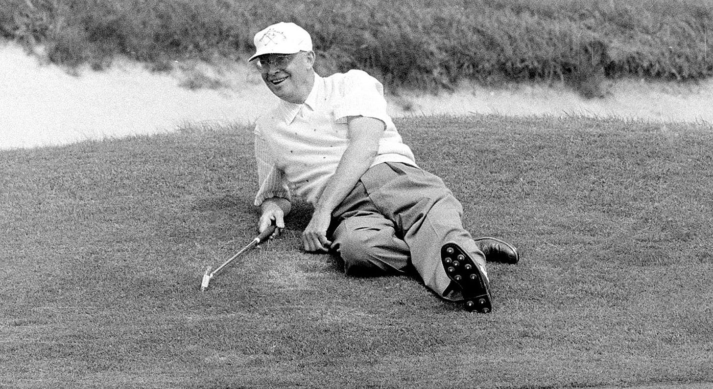 President Dwight Eisenhower relaxes at the 18th hole during a golf game in Newport, R.I., September 10, 1957. President Dwight Eisenhower relaxes at the 18th hole during a golf game in Newport, R.I., September 10, 1957.