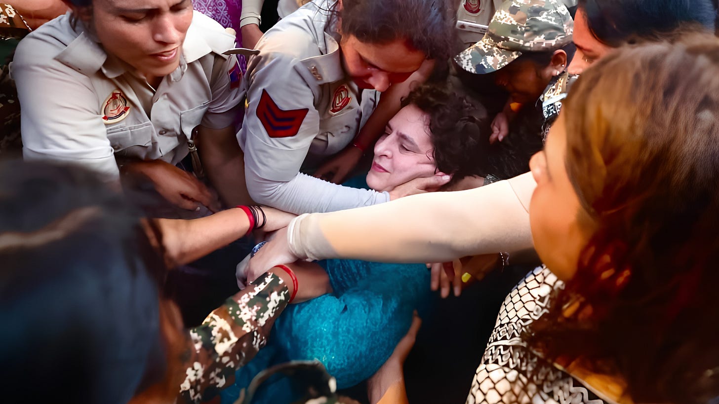 Delhi Police detaining Congress leader Priyanka Gandhi.