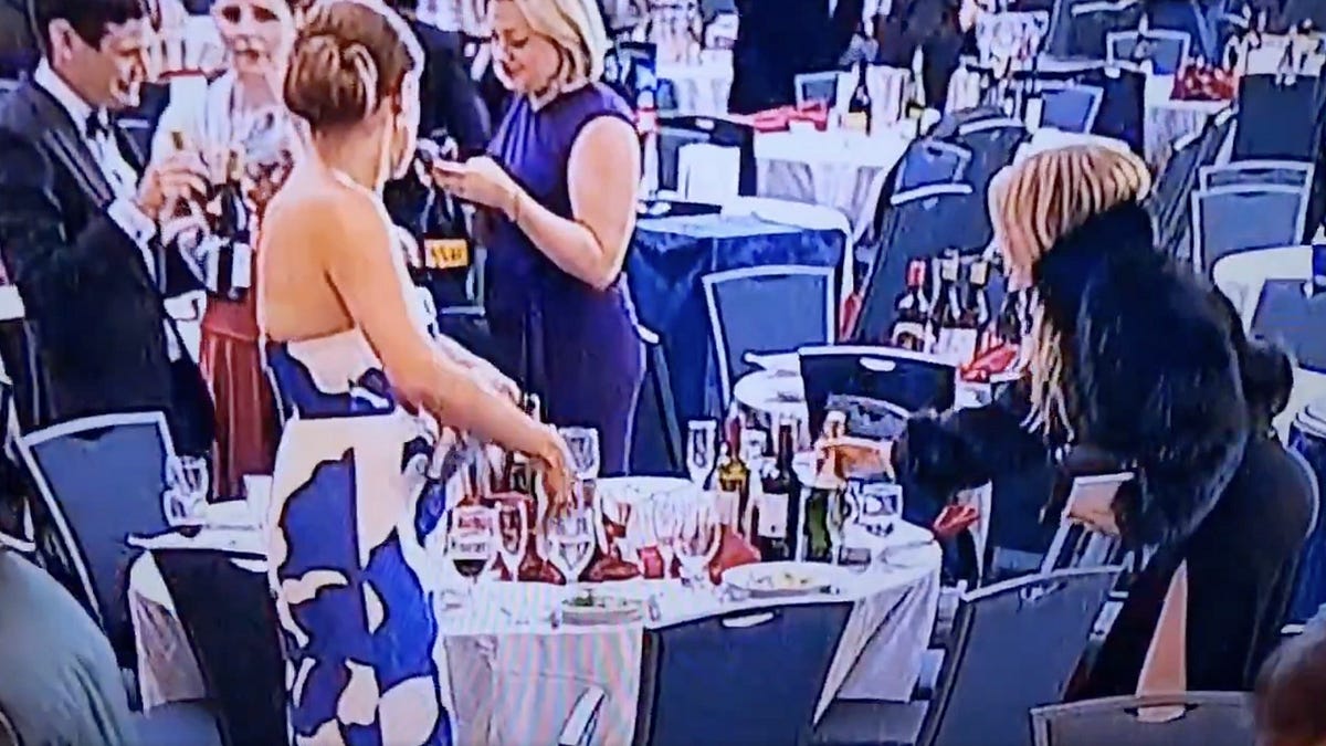Woman Seen Snatching Wine Bottles During Chaos After Trump Dinner Shooting