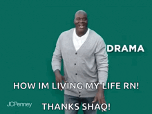a man in a gray cardigan is laughing and saying how im living my life rn .