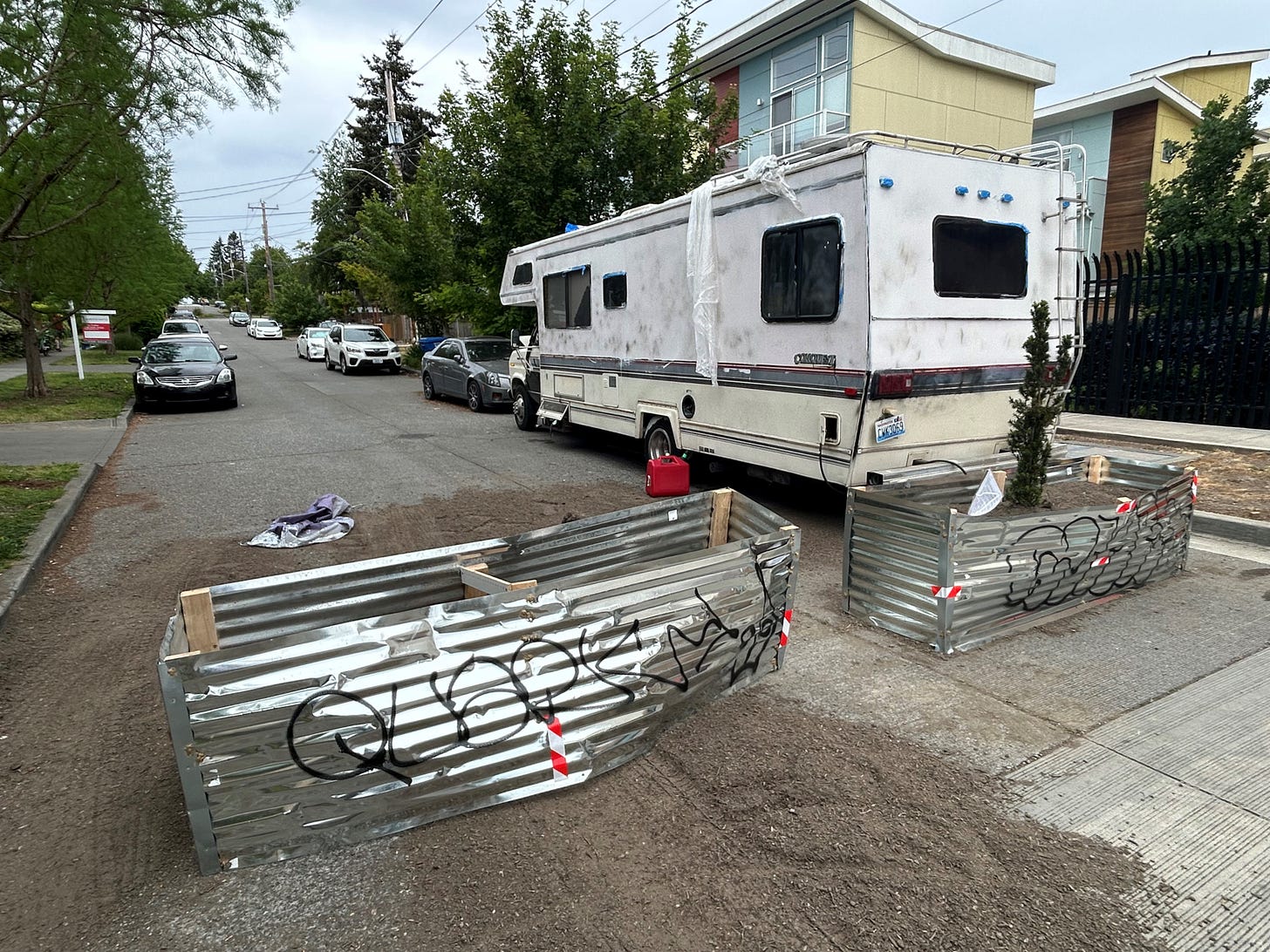 The barriers put up by neighbors include this one on N 97th Street, as well as on N 98th and N 102nd streets. (Photo: KOMO News)
