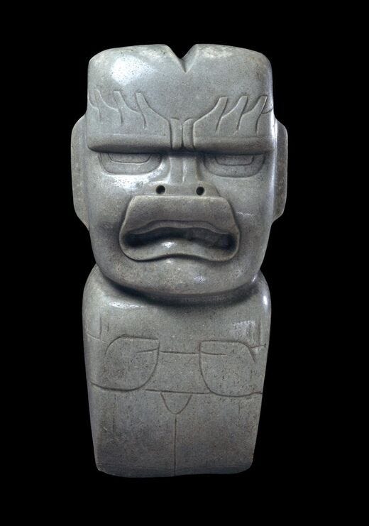 Jade votive axe, with cleft head, 1200-400 B.C.E., Olmec. Trustees of the British Museum.